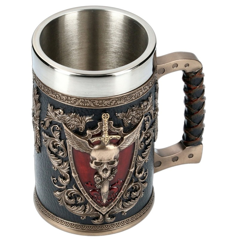 Unique stainless steel and resin beer mug featuring a 3D skull, winged sword, and ornate floral designs.