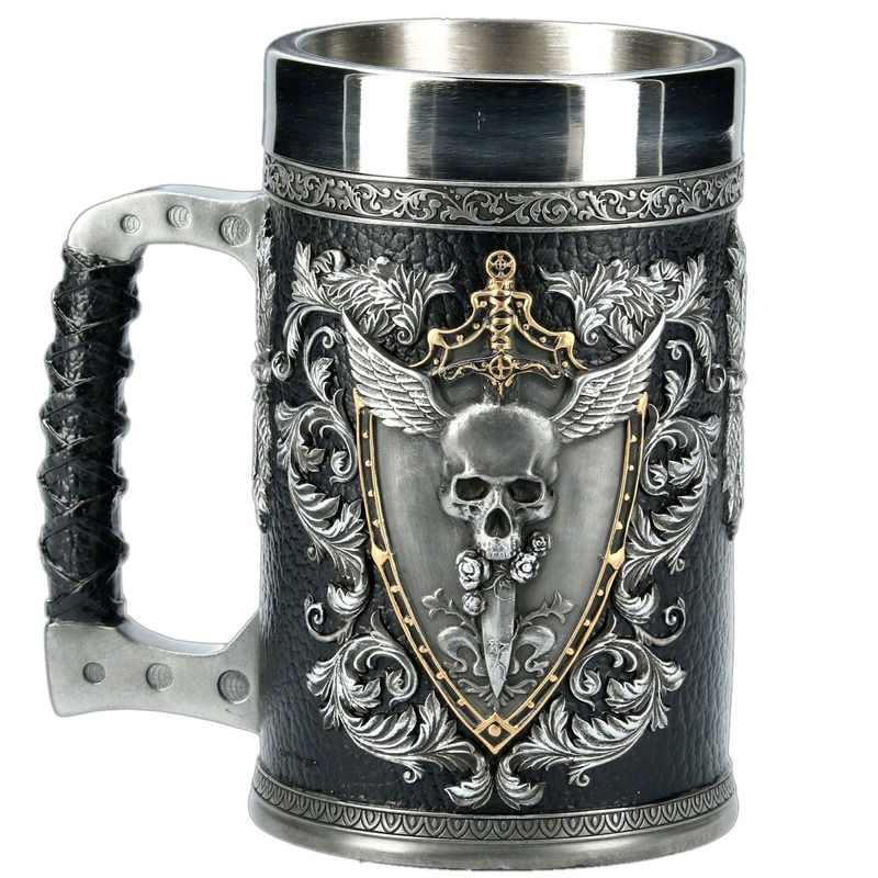 Vintage style stainless steel beer mug with skull and floral designs, featuring a handgrip and unique details.