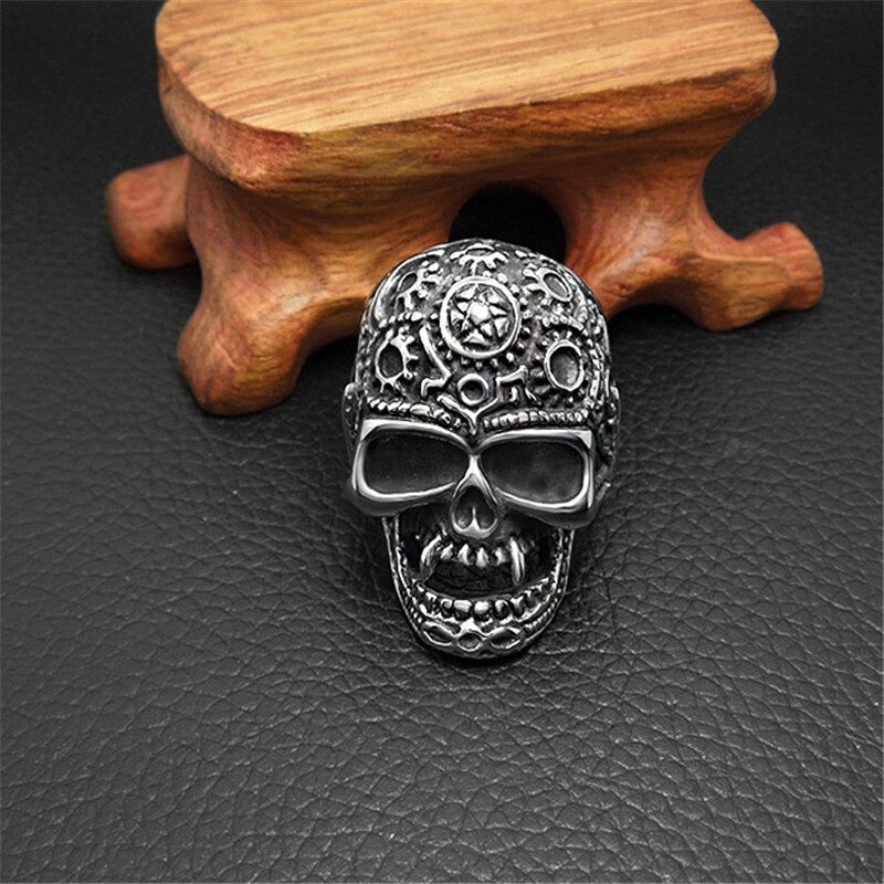 Stainless steel skull ring with intricate design, perfect for punk rock style and alternative fashion jewelry.