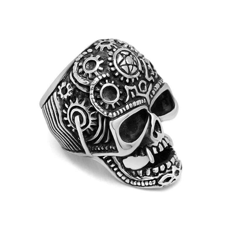 Detailed stainless steel skull ring with gears, perfect for punk rock style and alternative fashion jewelry.