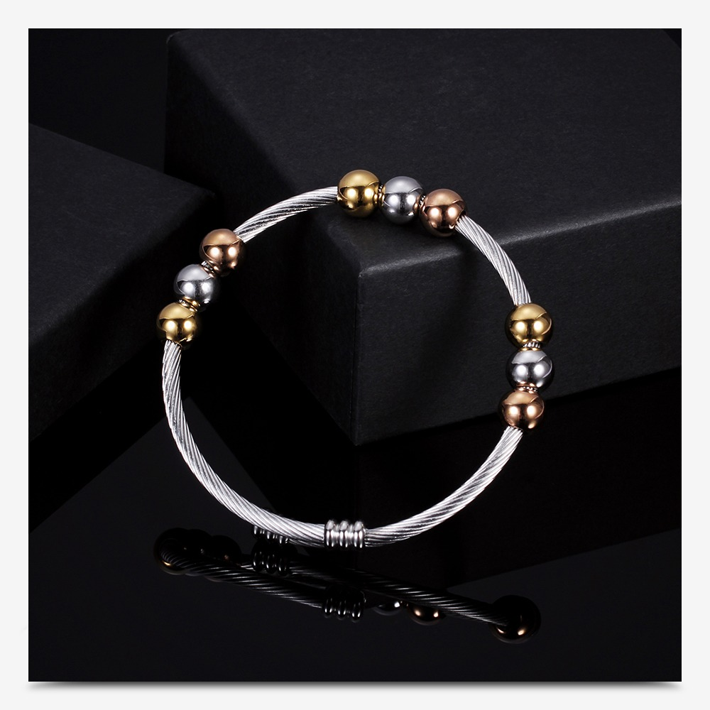 Stylish stainless steel bracelet in gold and silver colors, perfect for trendy outfits and adding sparkle.
