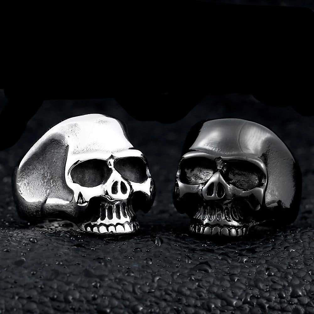 Stainless steel cute skull rings in polished silver and black finishes, perfect alternative fashion jewelry accessories.