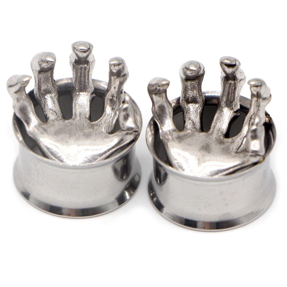 Stainless steel ear gauges featuring unique hand designs, perfect for a fashionable and edgy look.
