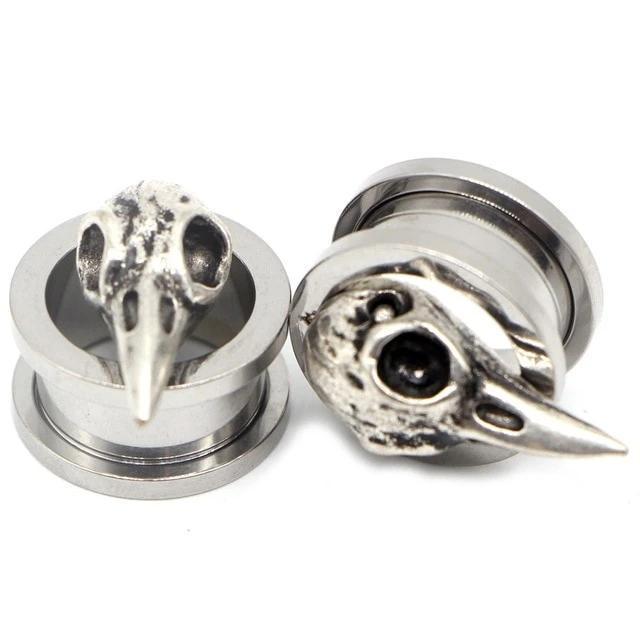 Stainless steel ear gauges featuring animal skull designs, perfect for edgy, unisex jewelry fashion.