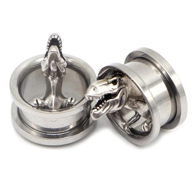 Stainless steel dinosaur ear gauges featuring T-Rex designs, perfect for trendy unisex body jewelry.