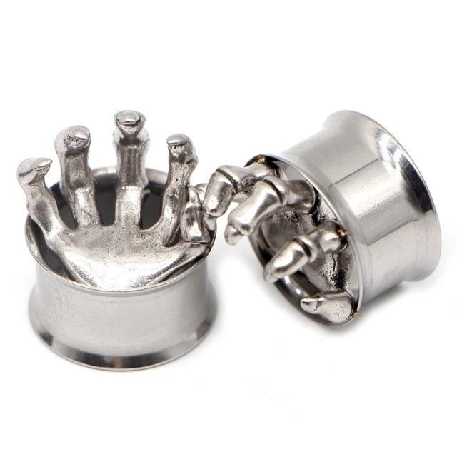Unique stainless steel ear gauges featuring quirky hand designs for a fun and edgy look in body jewelry.