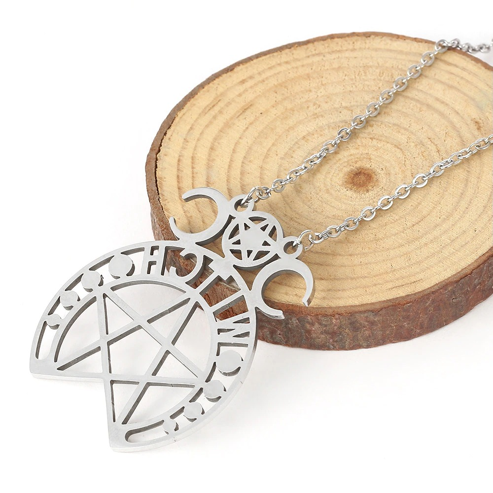 Gothic stainless steel pentagram pendant necklace on wood slice background, perfect for alternative fashion.