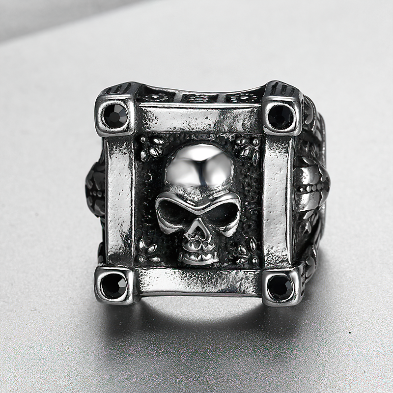 Stainless steel gothic ring featuring a skull design with black diamond accents, perfect for bikers and gothic fashion lovers.