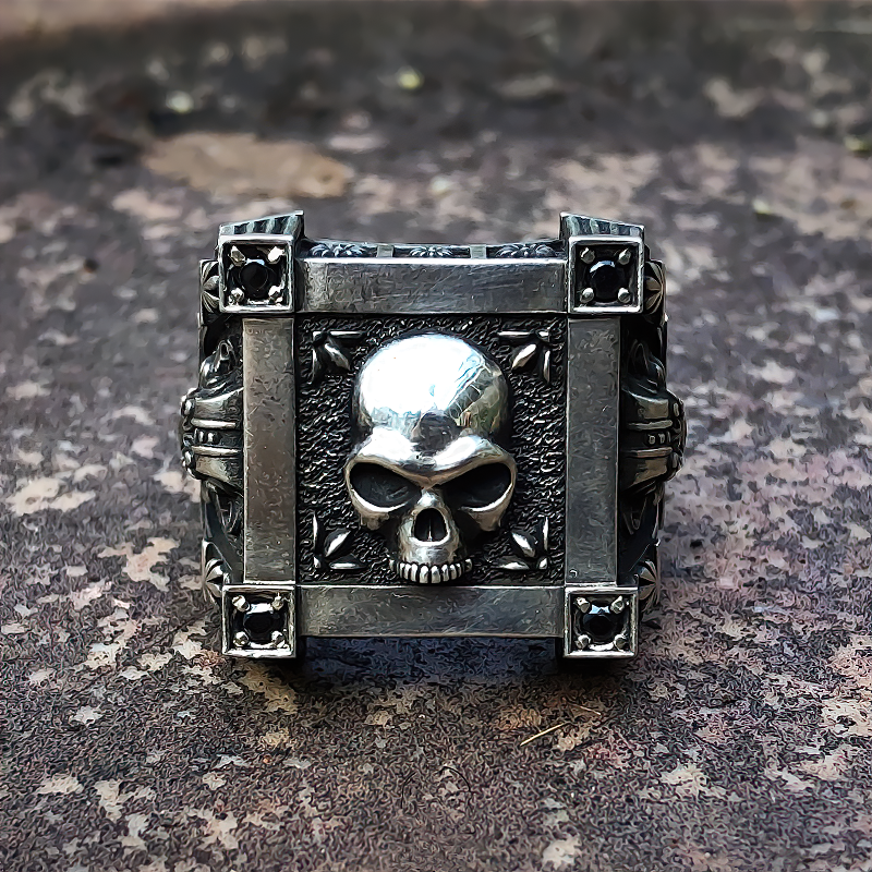 Stainless steel gothic ring featuring a skull design and black diamond accents, perfect for bikers and gothic lovers.
