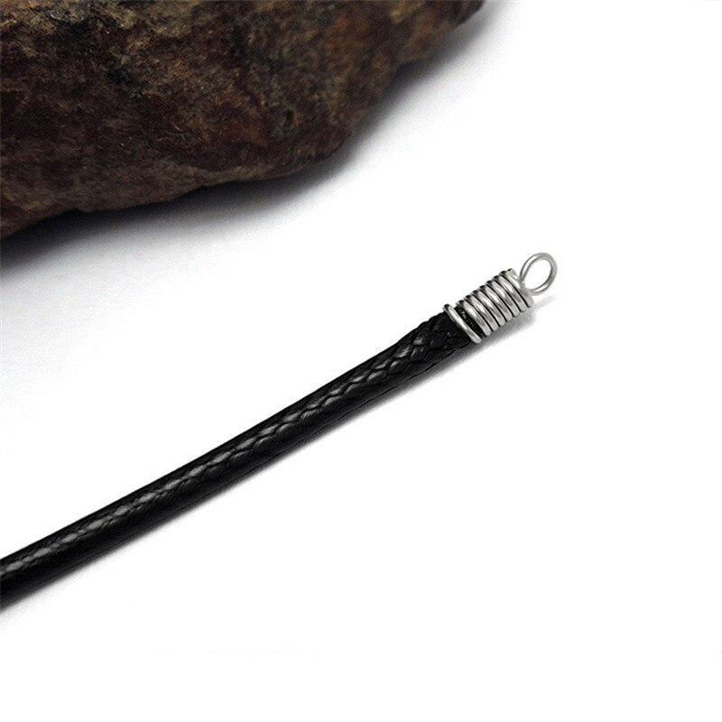 Close-up of black wax rope with stainless steel lock end, perfect for versatile fashion styles.