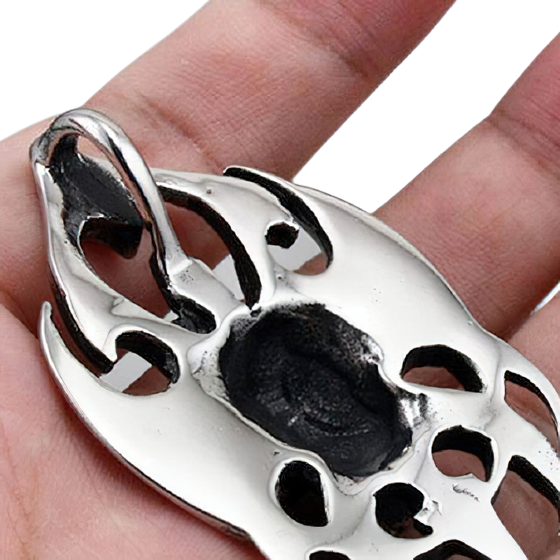 Close-up of a unisex stainless steel skull pendant in gothic style, perfect for rock fashion enthusiasts.