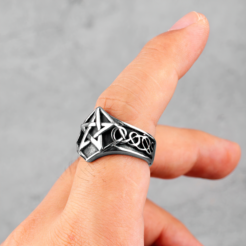 Stainless steel unisex pentagram ring on a finger, perfect for gothic and punk styles.