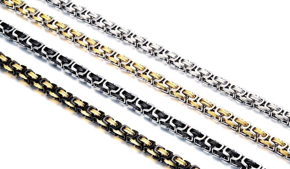 Stylish stainless steel biker necklace in black, silver, and gold twisted Singapore chain design.