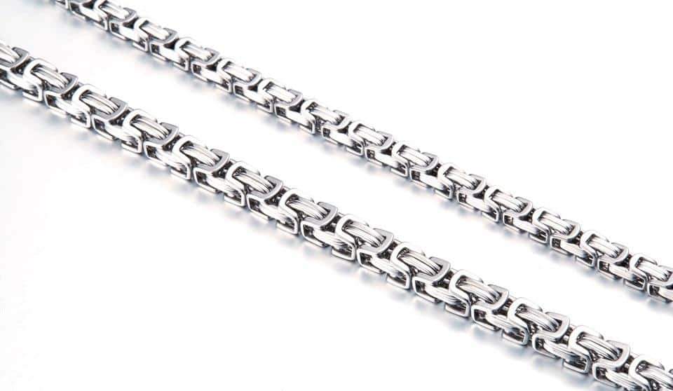 Stylish stainless steel biker necklace with a unique twisted Singapore chain design and geometric pattern.