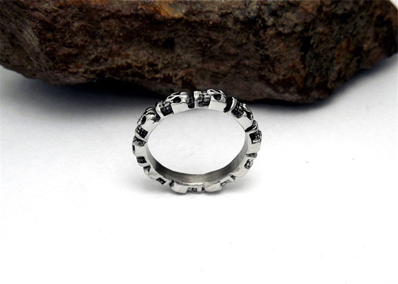 Stainless steel round skull ring with intricate skull patterns, unisex punk jewelry for bold fashion choices.