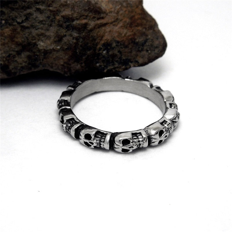 Stainless steel round skull ring with intricate skull pattern, unisex punk rock jewelry for bold fashion lovers.