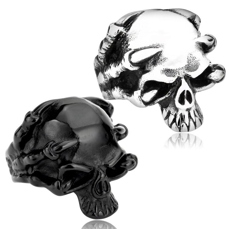 Stainless steel skull rings in black and silver, perfect for rock style jewelry and biker accessories.