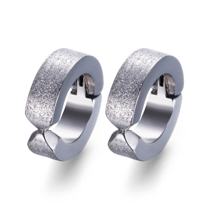 Stylish stainless steel stud earrings with a glitter finish, perfect for rock fashion lovers and unisex wear.