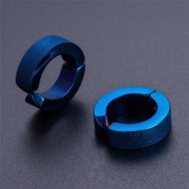 Stylish blue stainless steel hoop earrings for men and women, perfect for alternative fashion and rock accessories.