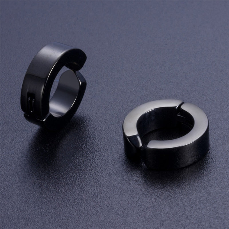Stylish black stainless steel stud earrings for men and women, perfect unisex rock accessories.