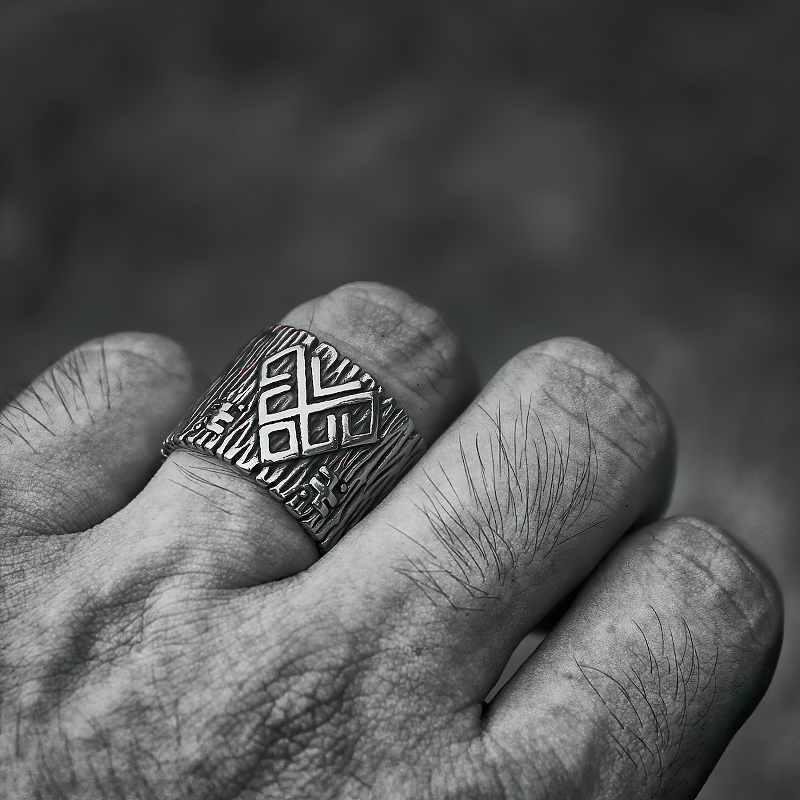 Stainless steel talisman ring with ancient rune designs, worn on a hand, ideal for men and women.