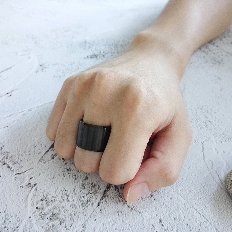 Stainless steel unisex black bulky ring showcased on a hand, ideal for gothic and casual styles.