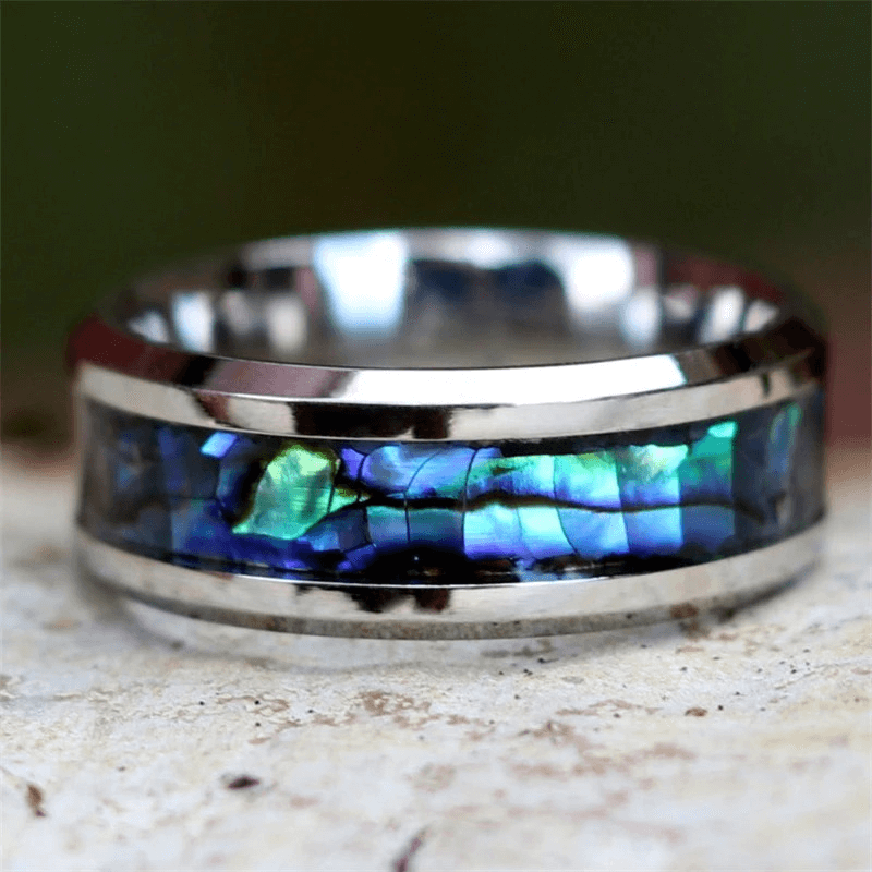 Stainless steel unisex ring featuring vibrant abalone inlay, perfect for casual style and adding flair to any outfit.