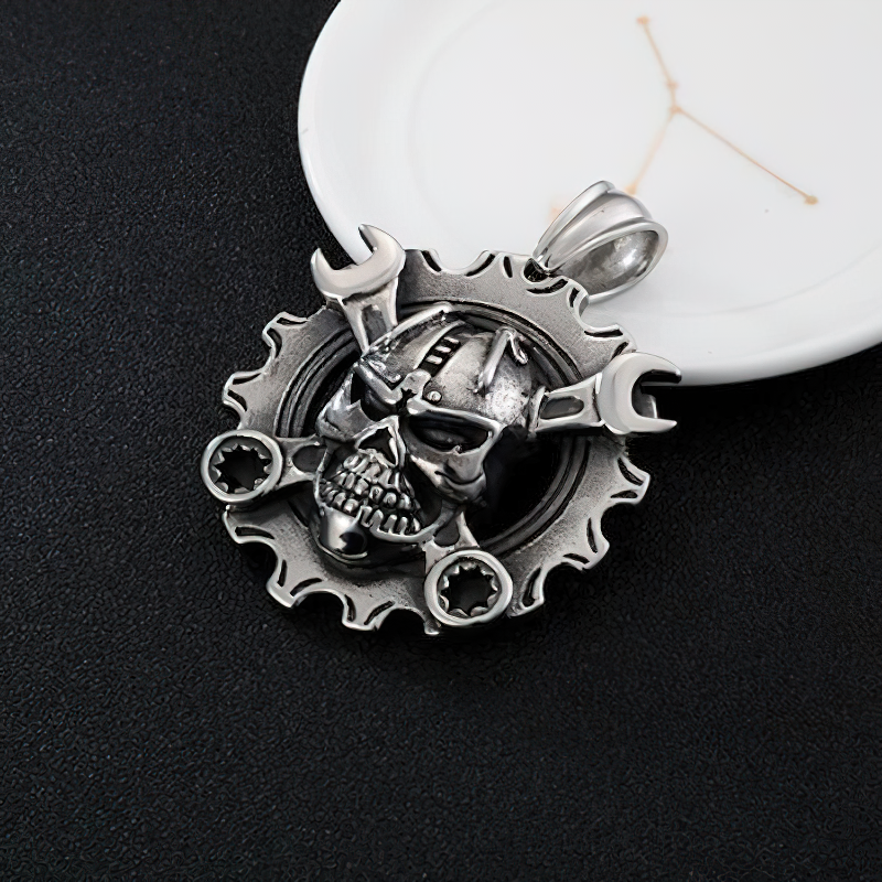 Stainless steel mechanical skull pendant with wrenches, perfect for punk style jewelry and adding edge to outfits.