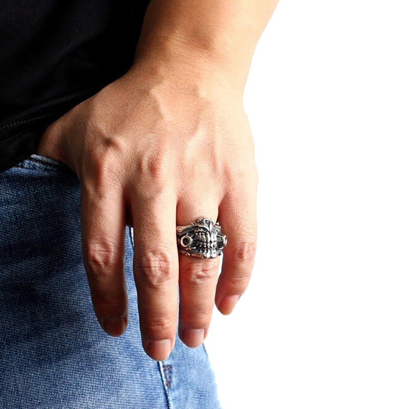 Man wearing a cool punk rock skeleton mask ring, showcasing alternative jewelry style.