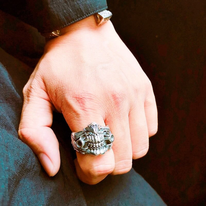 Skull mask ring worn on hand, showcasing punk rock style jewelry for men and women, perfect for cosplay.