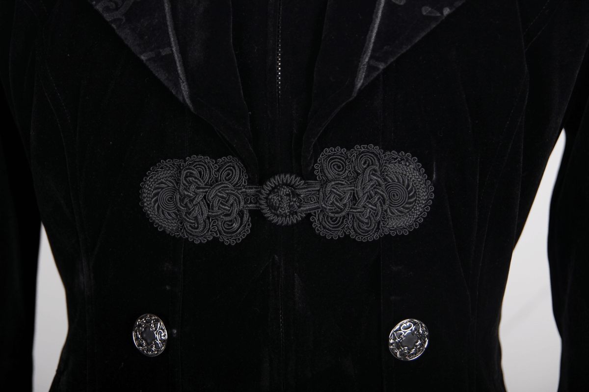 Close-up of steampunk black velvet coat with intricate buttons and ornate closure detail.