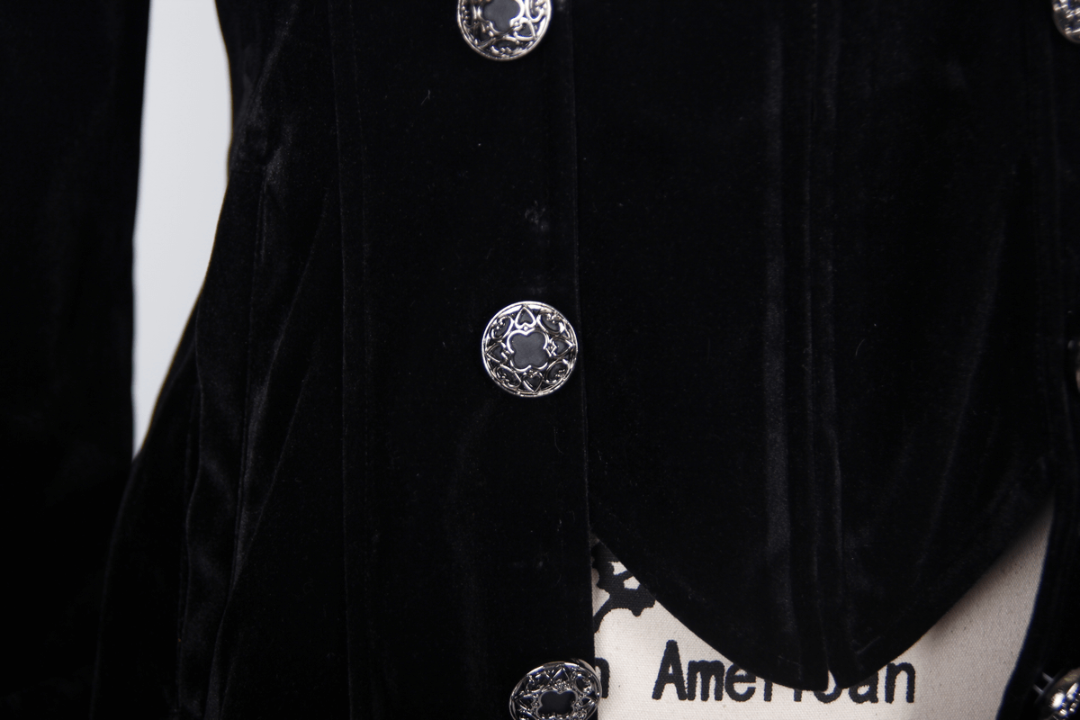 Close-up of velvet black steampunk coat buttons, showcasing retro gothic style and elegant detailing.