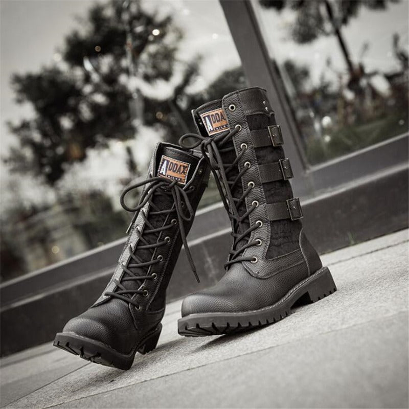 Stylish mid-calf steampunk military combat boots with lacing and a flat sole, perfect for alternative fashion.