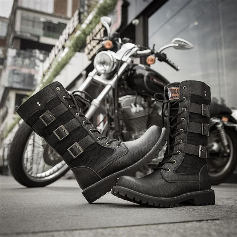 Stylish black steampunk combat boots with lacing and straps, perfect for bikers and rock outfits.