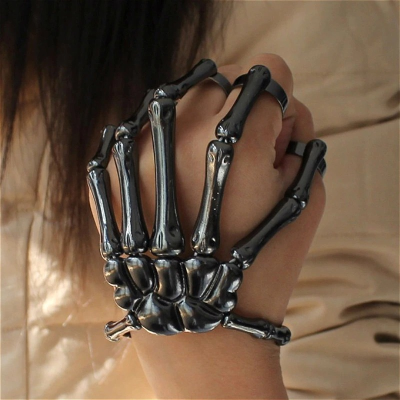 Unisex gothic skeleton bracelet showcasing a hand design, perfect for both men and women, highlighting its adjustable fit.