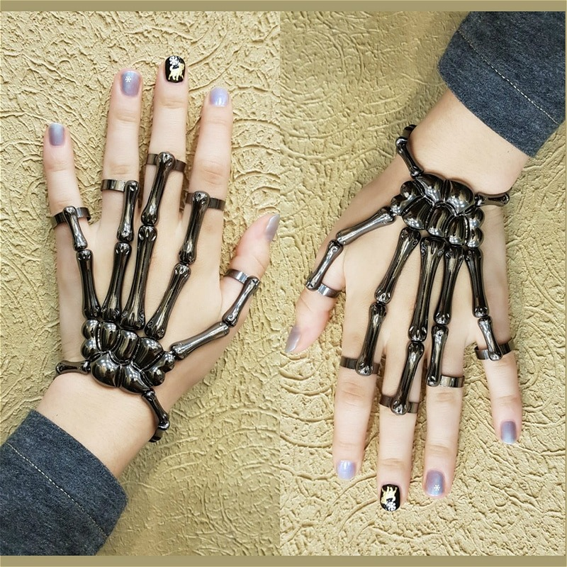 Unisex Gothic skeleton bracelet shown on hands, featuring an intricate skeletal design and adjustable fit.