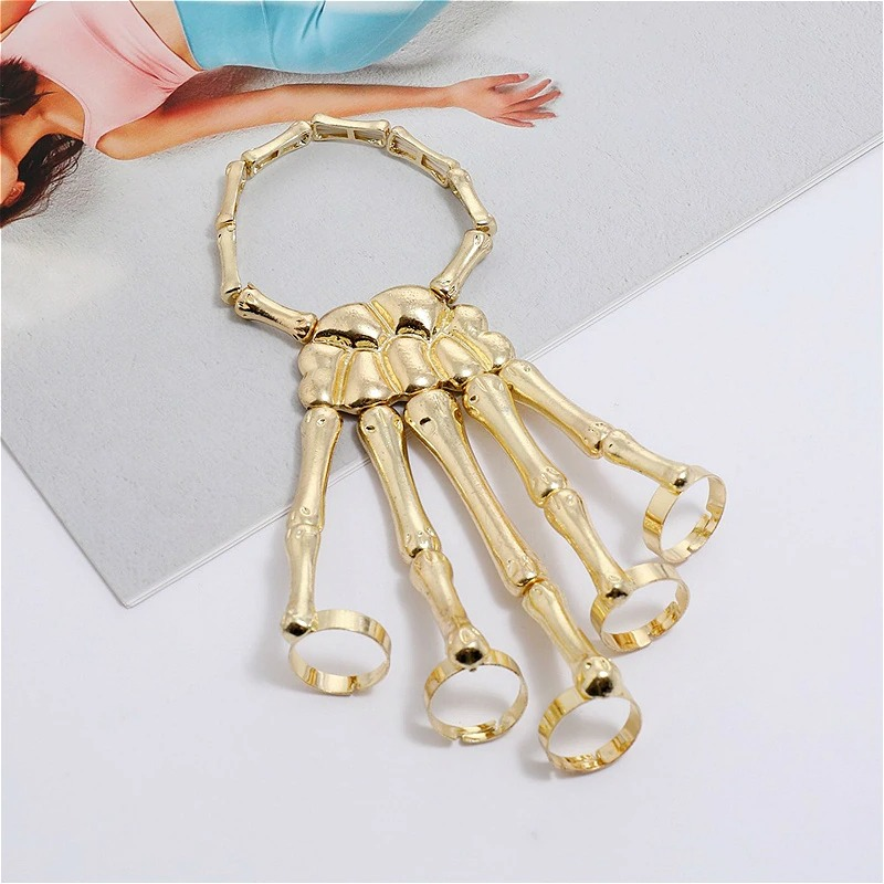 Gold skeleton hand bracelet, unisex gothic jewelry for men and women, adjustable elasticity for ultimate style.