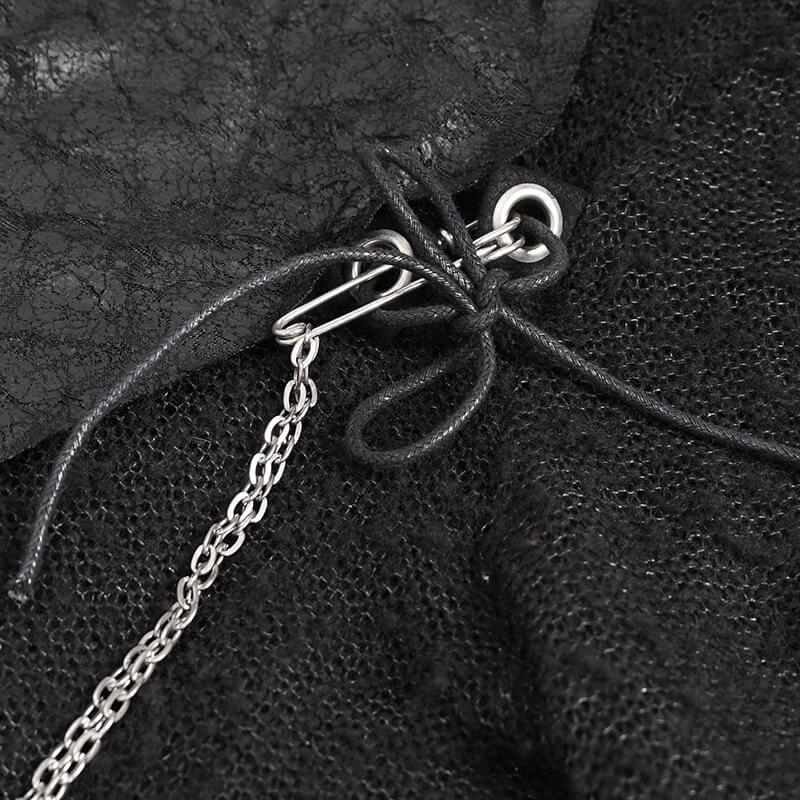 Close-up of black steampunk sweater detailing with chains and cords, showcasing unique gothic fashion elements.