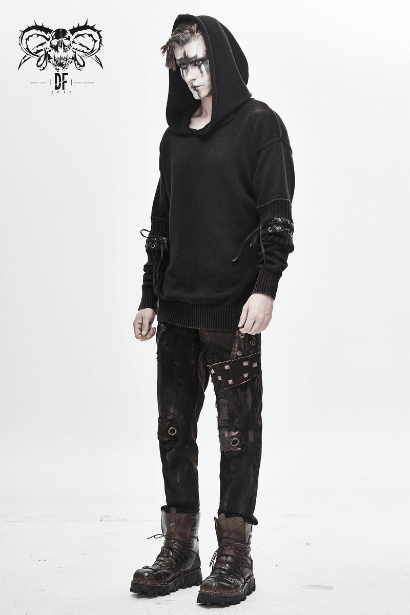Model wearing a black steampunk long sleeves hoodie with lace-up detailing, styled with edgy pants and boots.