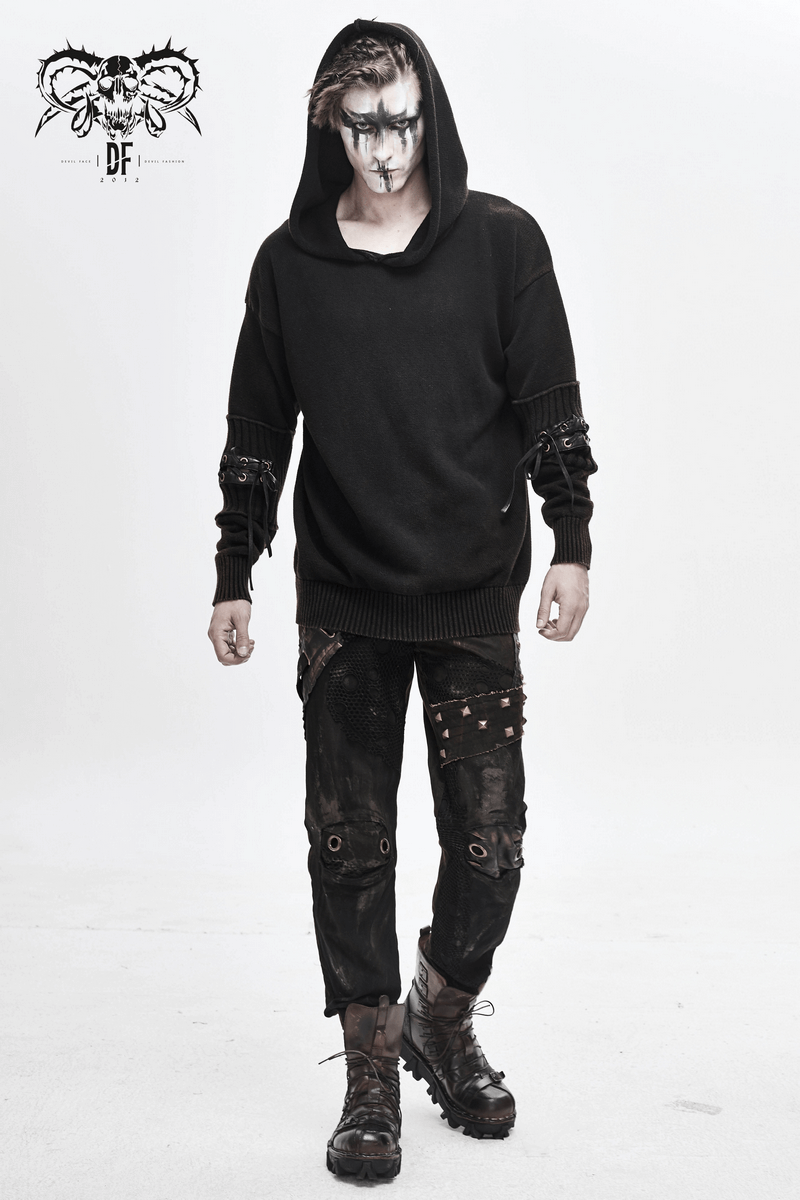 Model in a black steampunk hoodie with lace-up sleeves, showcasing a unique and trendy look for men's fashion.