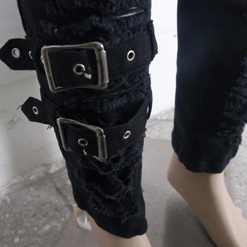 Close-up of ripped Gothic Steampunk pants showcasing buckle details and distressed fabric design.