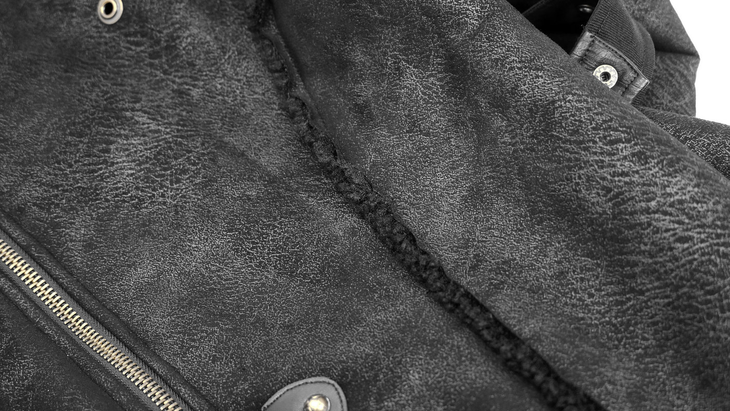 Close-up of a steampunk men's long winter coat showcasing the textured fabric and zipper detail.