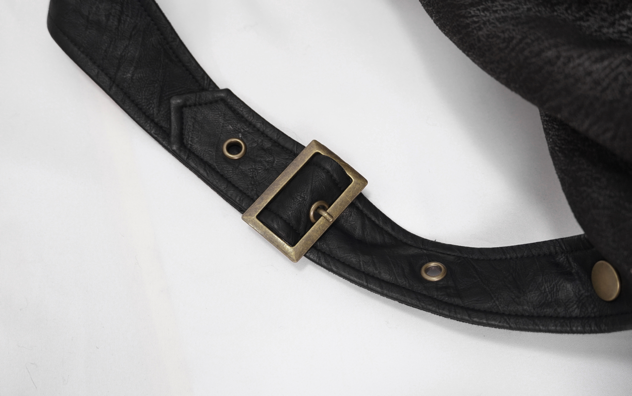 Close-up of the stylish brass buckle on a black steampunk coat belt, showcasing quality craftsmanship and design.