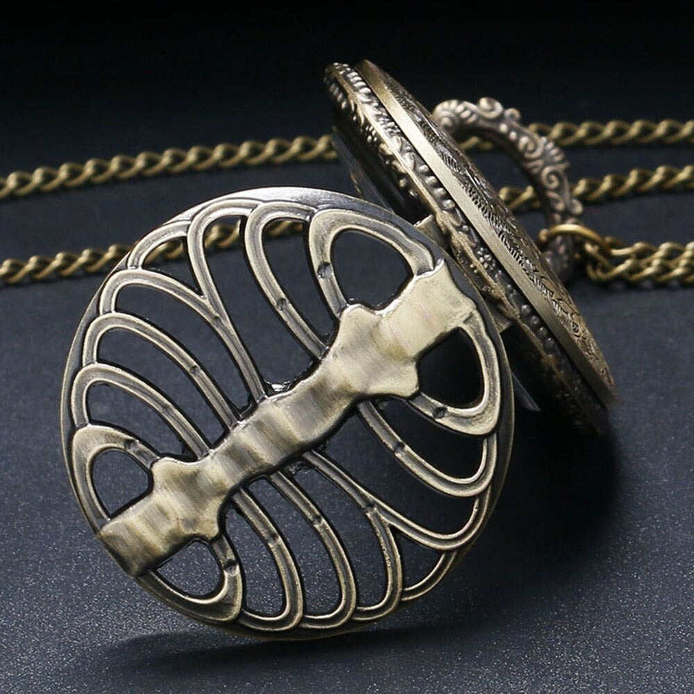 Steampunk hollow quartz pocket watch with intricate rib design and vintage chain, perfect for alternative fashion.