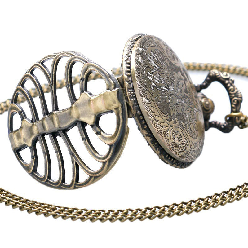 Steampunk hollow quartz pocket watch with intricate vintage design and steel chest pattern, perfect for alternative fashion.