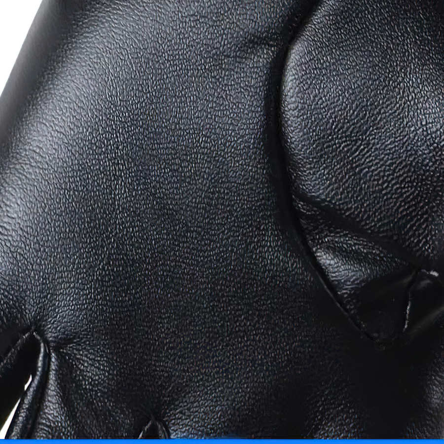 Close-up of black PU leather fingerless gloves with textured surface, perfect for steampunk fashion and alternative style.
