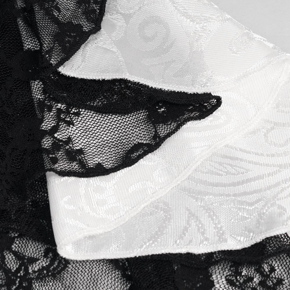 Close-up of black lace and white fabric details for a stylish steampunk shirt design.