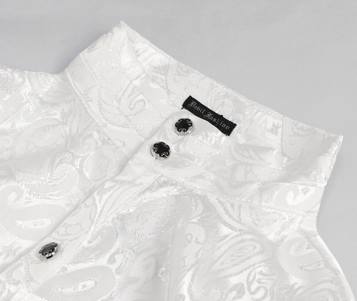 Close-up of a steampunk white men's shirt collar with intricate pattern and black buttons.