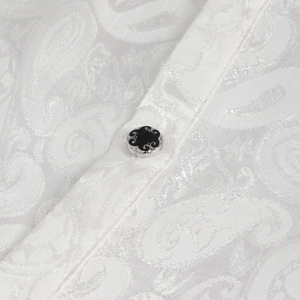 Close-up of a button on a steampunk white men's shirt showcasing intricate vintage pattern and elegant fabric texture.