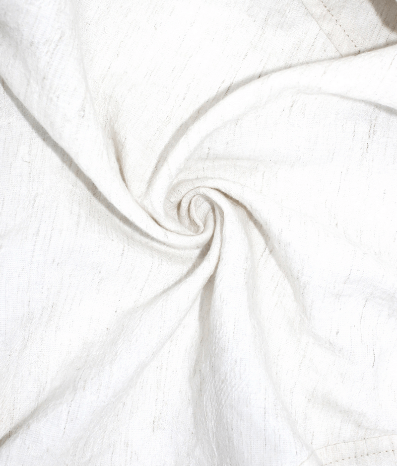 Swirling texture of soft white fabric for steampunk women's short puff sleeve blouse.